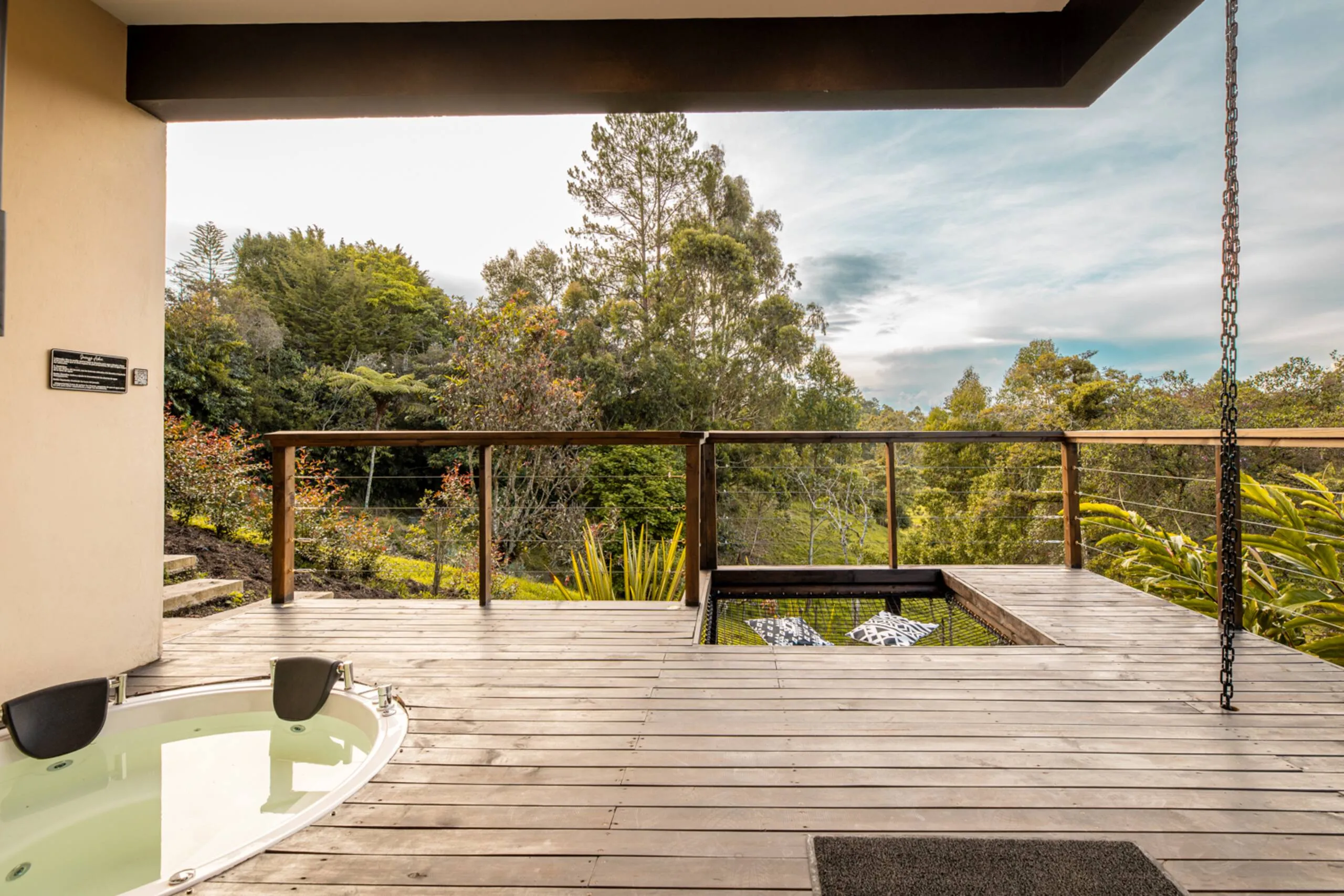 The deck and jacuzzi, open to the mountains